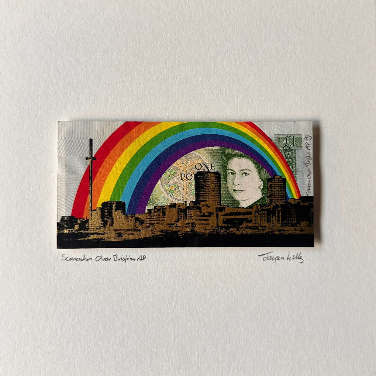 Print of rainbow over a cityscape on vintage one pound note